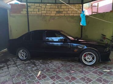 aston martin db7 5.9 at: BMW 5 series: 3.5 l | 1998 il Sedan — 3