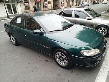 ford fusion ehtiyat hisseleri: Opel Omega sedan - Kuzov: 4 qapılı sedan, tünd-yaşıl rəng - Mühərrik — 3