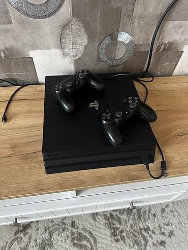 PlayStation 4 Pro - Daxildir: - 2 ədəd DualShock 4 simsiz idarəetmə