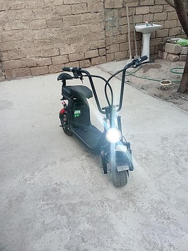 on lip: Elektrikli skuter satılır. Qara rəngli, oturacaqlı və kompakt dizayna — 2
