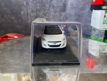 maşın modeli: Коллекционная модель Hyundai i30 5 door white 2012 Pino B&D Scale — 2