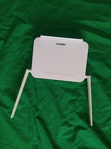 mobil internet modem: Model: Nokia G-1425G-B İşlək vəziyyətdədir. Metal korpusu açılıb — 2
