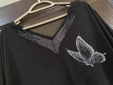 Qadın köynəyi – qara rəng, V-yaxa, qısa qollu. Ölçü 40-L. 42-XL. Tam — 6