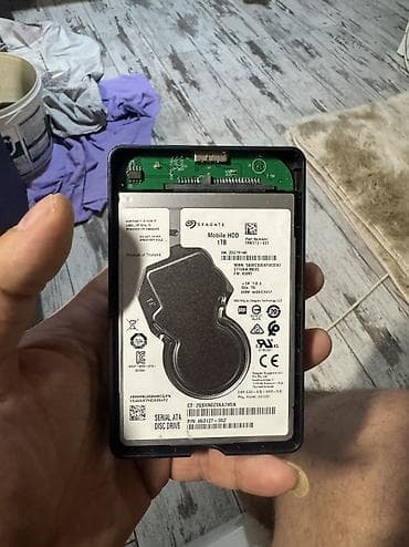 ipad mini 2: Hdd 1 tb madelin bilmirem sandisk kimi isdifade olunub yeni fileş — 1