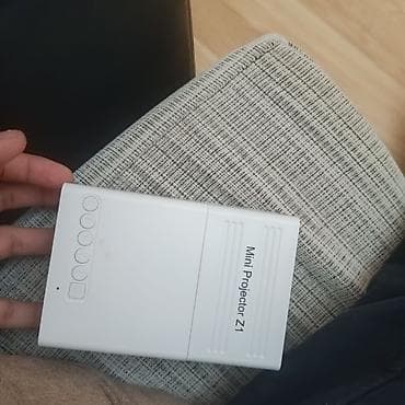wifi ap repeater: Portativ proyektor ağ rəngdədir və yığcam ölçüsü sayəsində daşımaq — 5