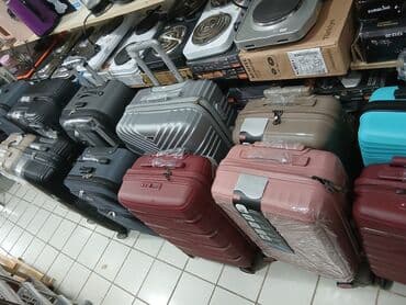 купить чемодан на колесах: Dörd təkərli səyahət çantası, möhkəm materialdan hazırlanmışdır və — 15