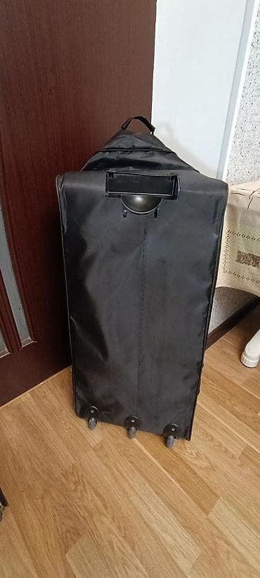 Böyük ölçülü təkərli səyahət çantası - Rəng: qara - Material: sıx — 2