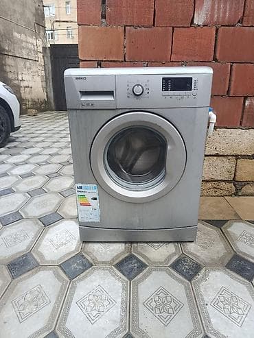 Beko önyükləməli paltaryuyan maşın.tək problemi qapisindadir - Model