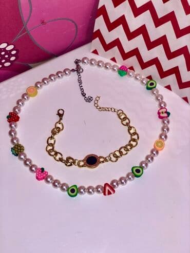 Eynəklər: Mirvari boyunbağı müxtəlif meyvə formalı muncuqlarla bəzədilmişdir. Bu — 2