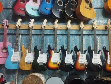 Çox cuzi işlenmiş elektro gitaralar cemi 99azn. cemi 4ed qalıb. unvan