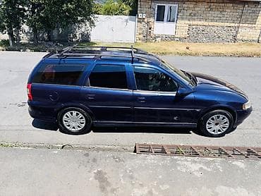 46 kuza: Opel Vectra Caravan (Universal), tünd mavi rəng. Xüsusiyyətlər: - — 7