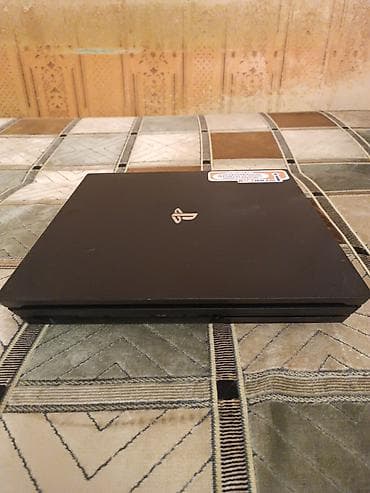 playstation 4: Sony PlayStation 4 Pro oyun konsolu və DualShock 4 simsiz idarəetmə — 2