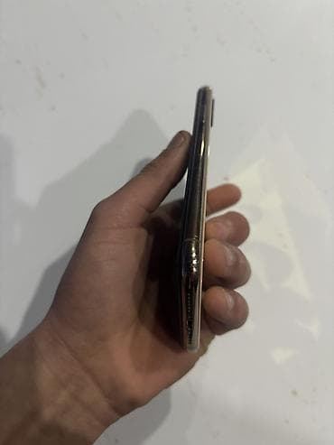 divarda televizor fiqurlari: IPhone Xs, 64 GB, Qızılı, Face ID — 4