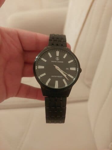 brilyant qaşlı üzük metni: David Guner kişi qol saatı - Korpus: dairəvi, qara rəngli. - — 1