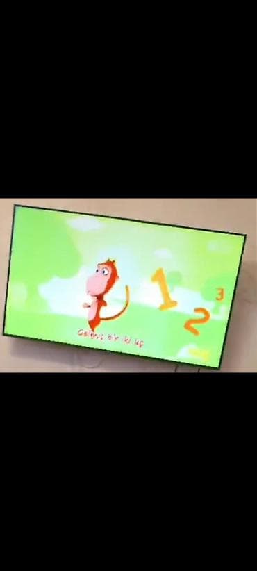 android smart box tv: LED televizor – divar asılqanı ilə - Ekran: təxminən 40–50 düym — 1