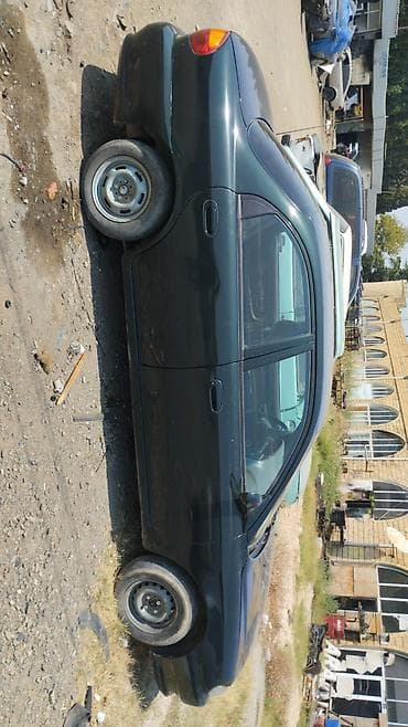 jeton satişi: Kia Sephia: 1.6 l | 1997 il Sedan — 3