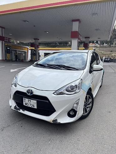 Продажа авто: Toyota Aqua hibrid hetçbek - Rəng: ağ - Kuzov: 5 qapılı hetçbek - — 2