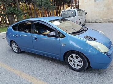 masin satmaq: Toyota Prius (2-ci nəsil) hibrid liftbek - Rəng: mavi, tünd şüşələr - — 5