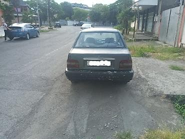 4 teker: Avtomobil: 4 qapılı sedan Rəng: Tünd boz Yanacaq: Benzin Ötürücü — 2