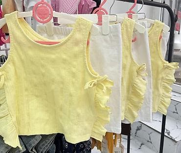 Uşaq qız üçün yay dəsti – sarı qolsuz top və ağ şort - Top: yumşaq