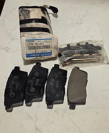 07 şit: Mazda orijinal ön əyləc bərkidici dəsti - Brend: Mazda Genuine Parts — 1