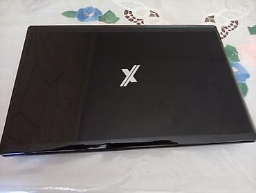 komputer core i5: Noutbuk – qara, parlaq korpus, üzərində “X” loqosu. Xüsusiyyətlər: - — 1