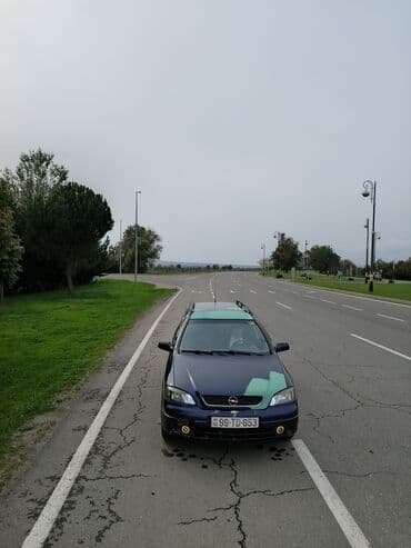 опель астра универсал: Opel Astra Caravan (universal) – mavi rəngli, ön tərəfdən geniş — 3