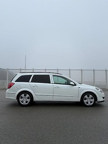 elektrikli moped: Opel Astra H Caravan (Universal), ağ rəng Texniki xüsusiyyətlər və — 5