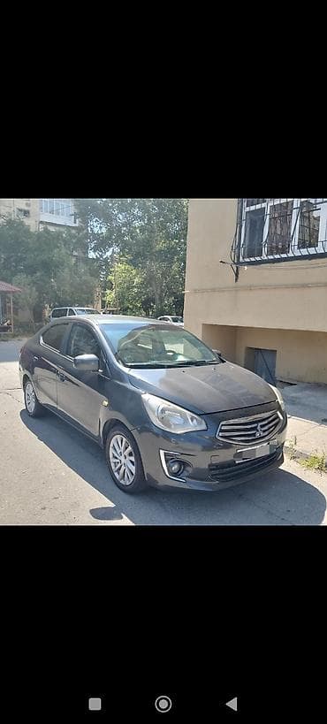 13 disk: Mitsubishi Attrage sedan - Kuzov: 4 qapılı sedan, tünd boz rəng - — 2