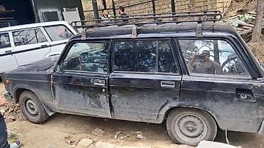lider disk 17: VAZ 2104 universal, qara rəng. Klassik kuzov, 5 qapı, geniş baqaj — 5