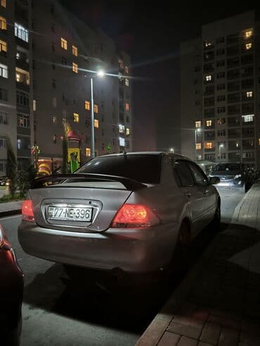 e 124: Mitsubishi Lancer: 1.6 l | 2006 il 34000 km Sedan — 1