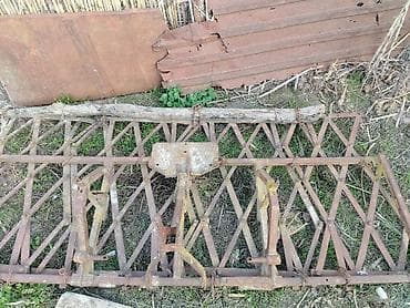 oka kreditle: Kənd təsərrüfatı üçün çəkilə bilən dəmir mala (sürgü). - — 2