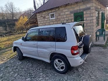 vossen diskleri: Mitsubishi Pajero iO GDI, ağ rəngdə kompakt off-road SUV — 4