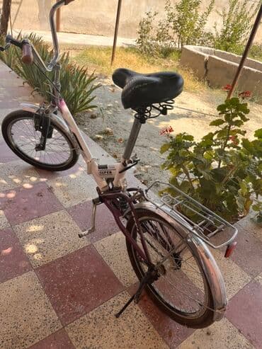 aurus велосипед: Stels markalı bu qatlanan velosiped ağ və bənövşəyi rəngdədir. Kiçik — 1