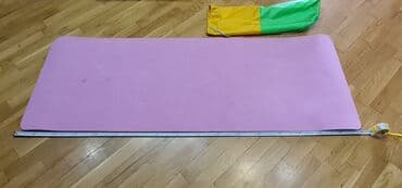 yoqa mat: Çəhrayı rəngli, yüngül və daşımaq üçün çantası olan yoqa matı. Matın — 1