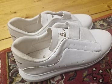 online geyim: - Brend yazısı: Alexander McQueen (loqo və ad içlikdə və dil — 2