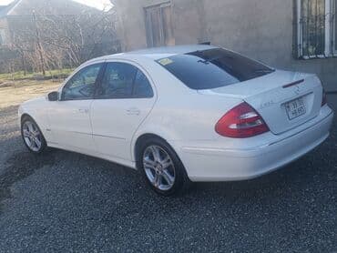 Mercedes-Benz 320: 3.2 l | 2002 il Sedan