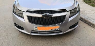 priora buferi: Ön, Chevrolet Curuze, 2012 il, ABŞ, Ünvandan götürmə — 2
