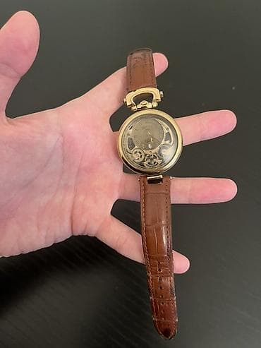 Məhsul: Mexaniki qol saatı – skeleton dizaynlı, qızılı korpus, qəhvəyi