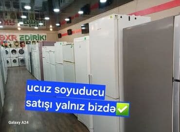 Məişət texnikası mağazasında geniş seçimli soyuducu satışı. - Fərqli