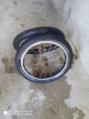 berkut velosiped: İki ədəd təkərli velosiped təkəri. Hər bir diskdə 28 mil var və qara — 2