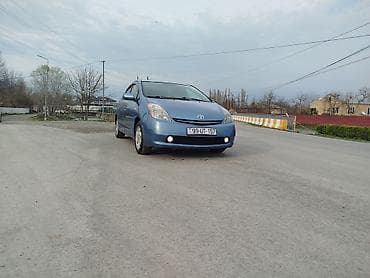 ilkin odənişsiz avtomobil: Toyota Prius, mavi rəng, 5 qapılı hatchback, hibrid. - Yüngül lehimli — 2