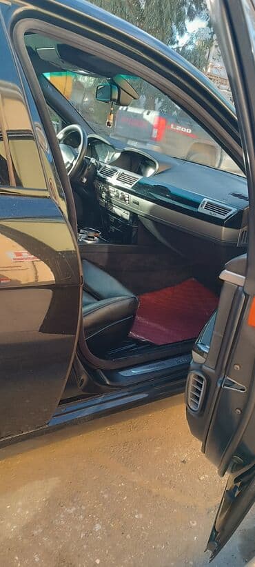 Audi: BMW 7 series: 4.8 л | 2006 г. Седан — 8