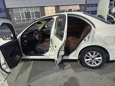 brabus disk: Nissan Sunny: 1.3 l | 2008 il Sedan — 4