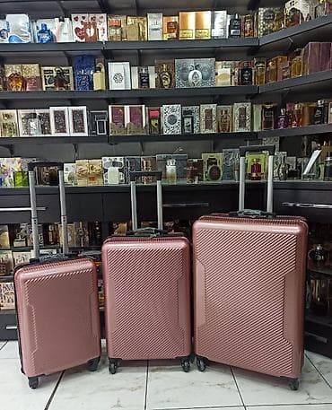 Sərt korpuslu səyahət çamadan dəsti – 3 ölçü - Rəng: metalik tünd gül