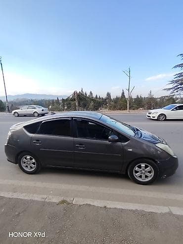 qolf car: Toyota Prius (2-ci nəsil) hibrid hetçbek - Rəng: tünd boz/boz-qara - — 6