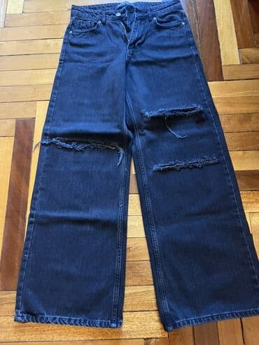 ketan şalvar: Geniş kəsimli, tünd mavi rəngli cins şalvar. - Diz və bud hissələrində — 1