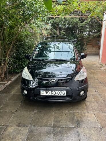 kia optima 2019: Arxa tərəfində "i10" yazısı olan qara rəngli Hyundai i10 modeli — 4