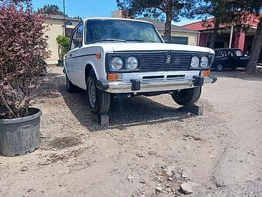 lada most: VAZ 2106, ağ sedan Xüsusiyyətlər: - Kuzov: sedan, ağ rəng - Klassik — 2