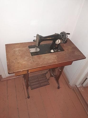 Mexaniki tikiş maşını – pedallı masaüstü
Ṣüvəlanda — 2